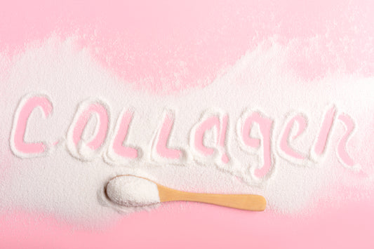 Collagen or protein in powder format on pink background. Beauty supplement.