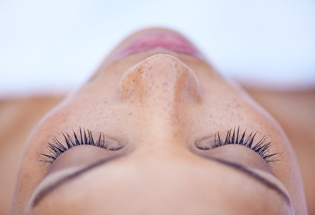 Close-up of woman with beautiful skin in a deeply relaxed state of mind