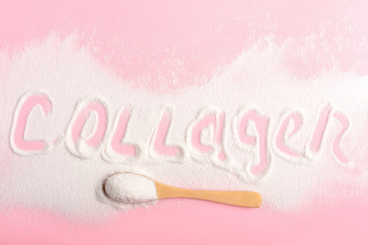 Collagen or protein in powder format on pink background. Beauty supplement. 