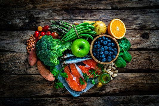 Fish, vegetables and fruit display in heart shape