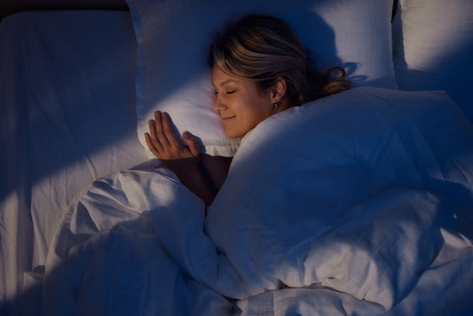 woman smiling in bed